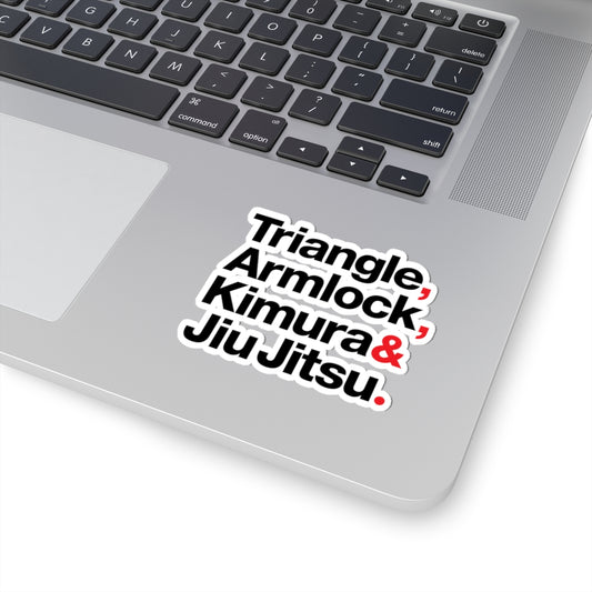 Laptop with a 'Triangle Armlock Kimura & Jiu Jitsu' sticker on the palm rest area.