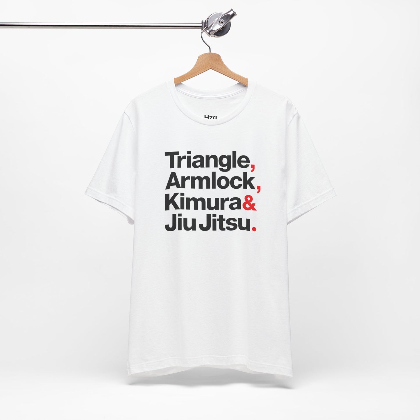 White t-shirt with martial arts terms on a hanger against a white background