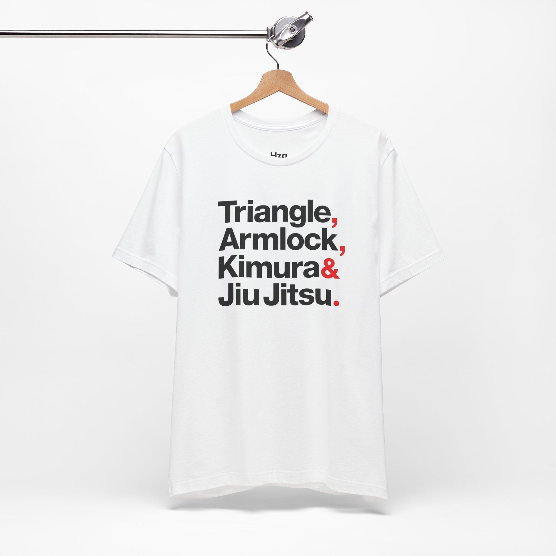 White t-shirt with martial arts terms on a hanger against a white background