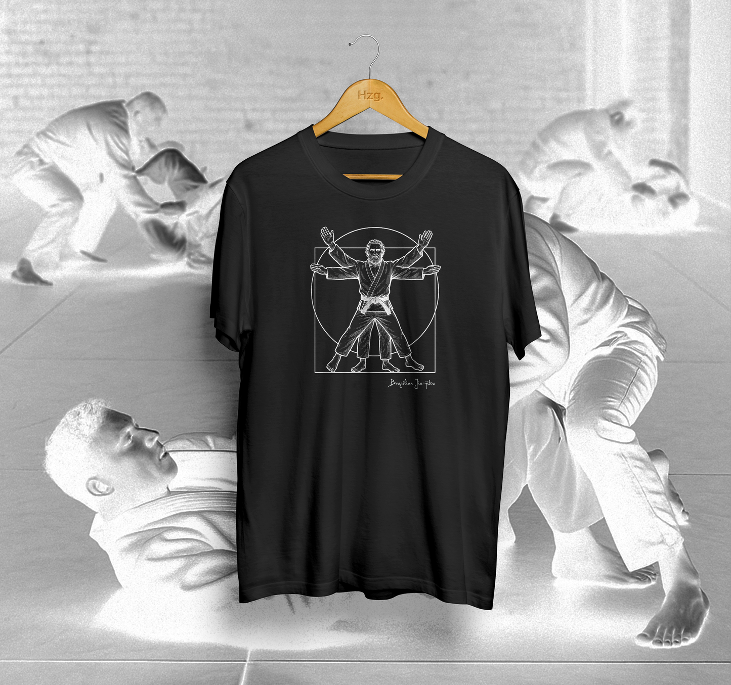 Black t-shirt with a graphic design on a hanger against a gray background with sculptures.
