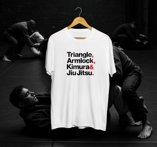 White t-shirt with martial arts text on a hanger against a black background with people practicing martial arts.