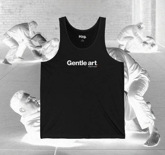 Black tank top with 'Gentle art' text on a gray background with abstract figures.