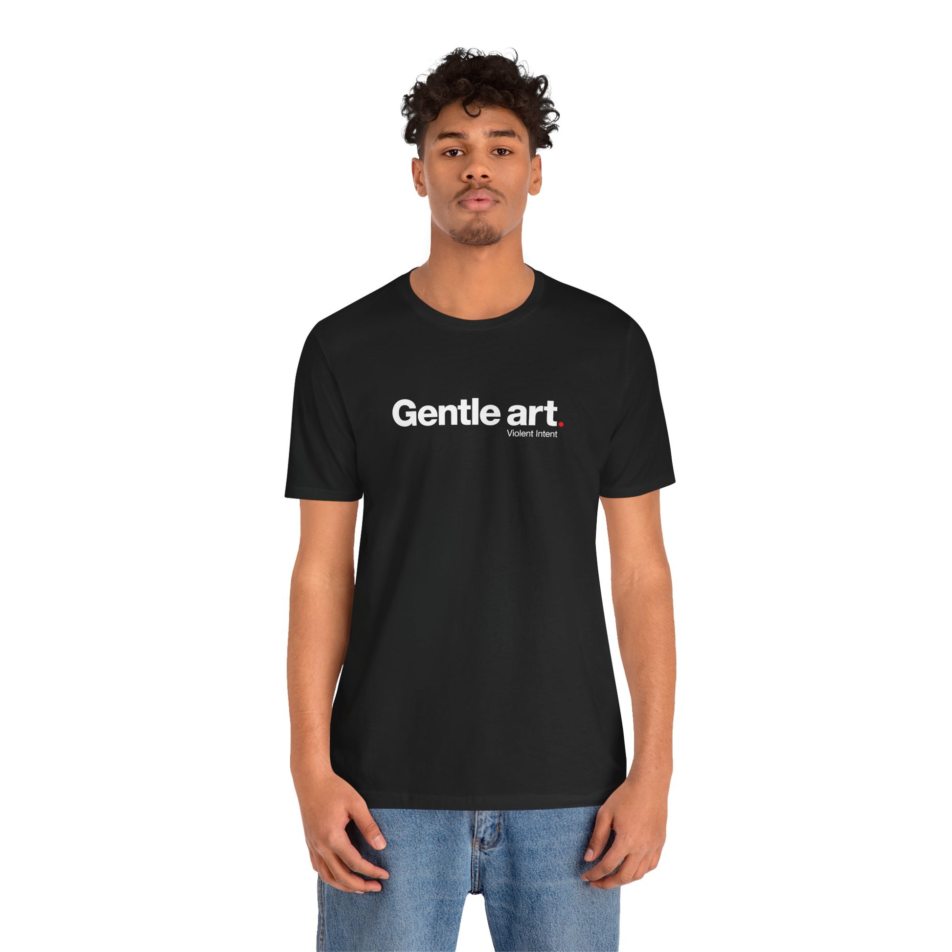 Person wearing a black t-shirt with 'Gentle art' text on a white background