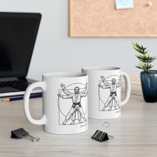Two white mugs with artistic illustrations on a desk with office supplies.