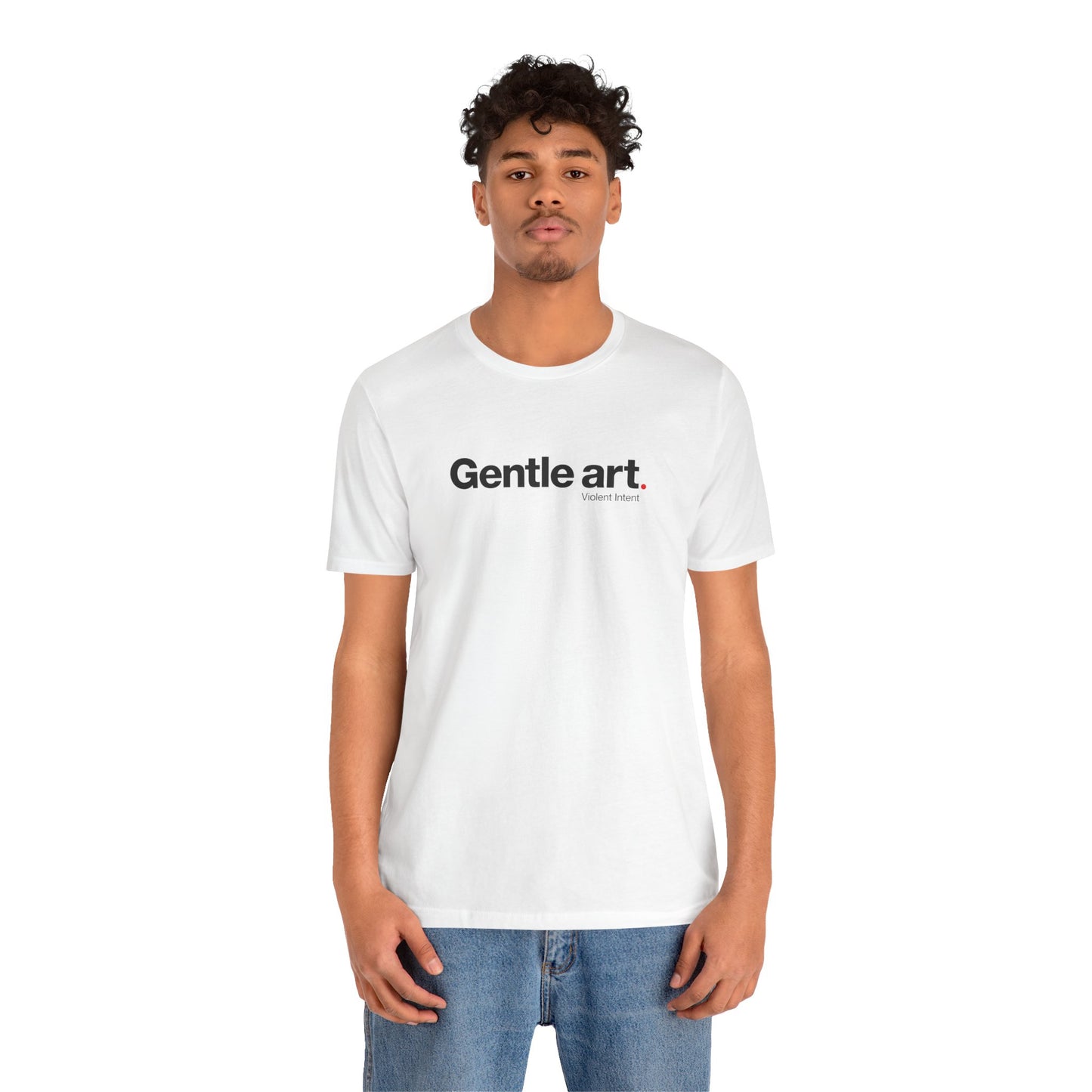Person wearing a white t-shirt with 'Gentle art' text on a white background