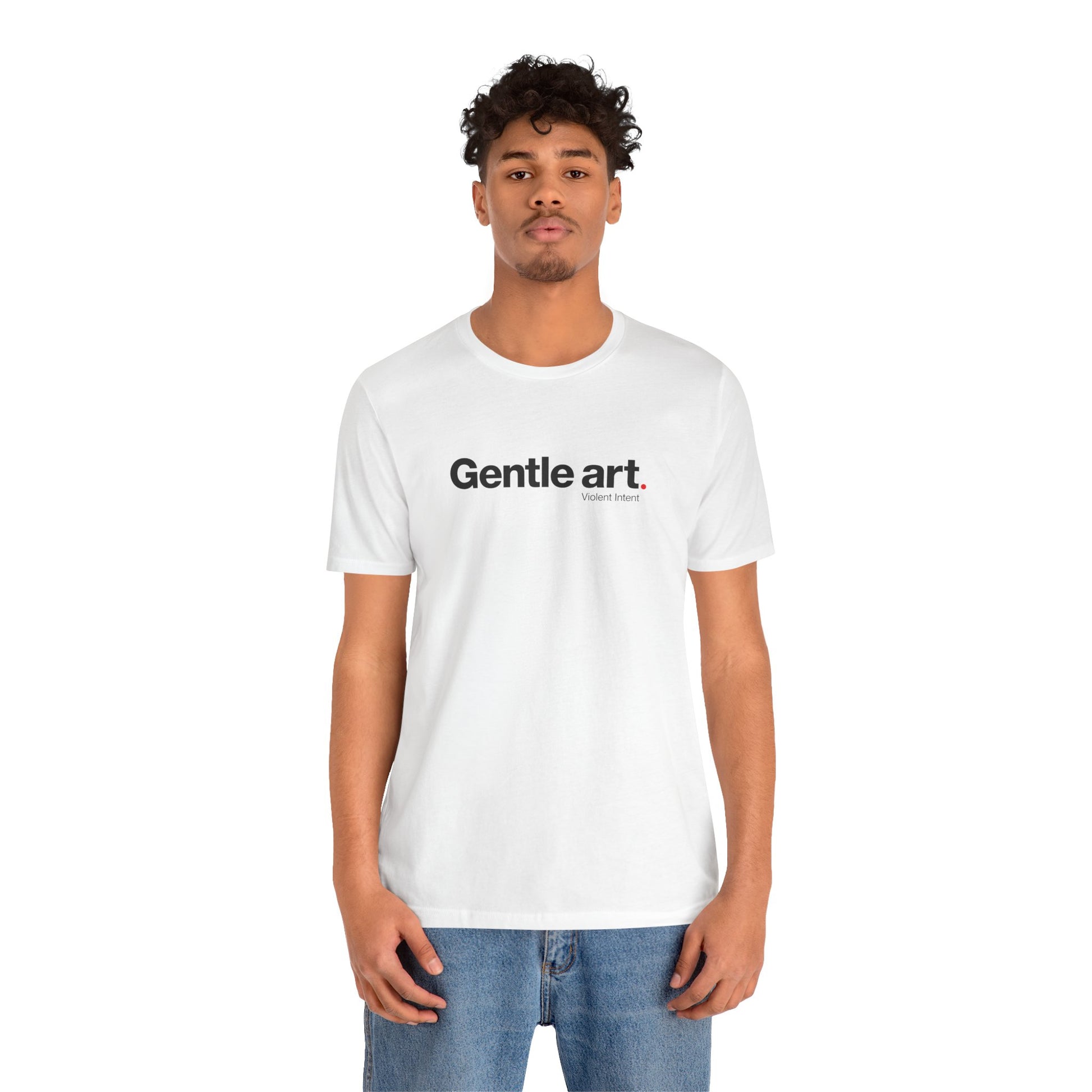 Person wearing a white t-shirt with 'Gentle art' text on a white background