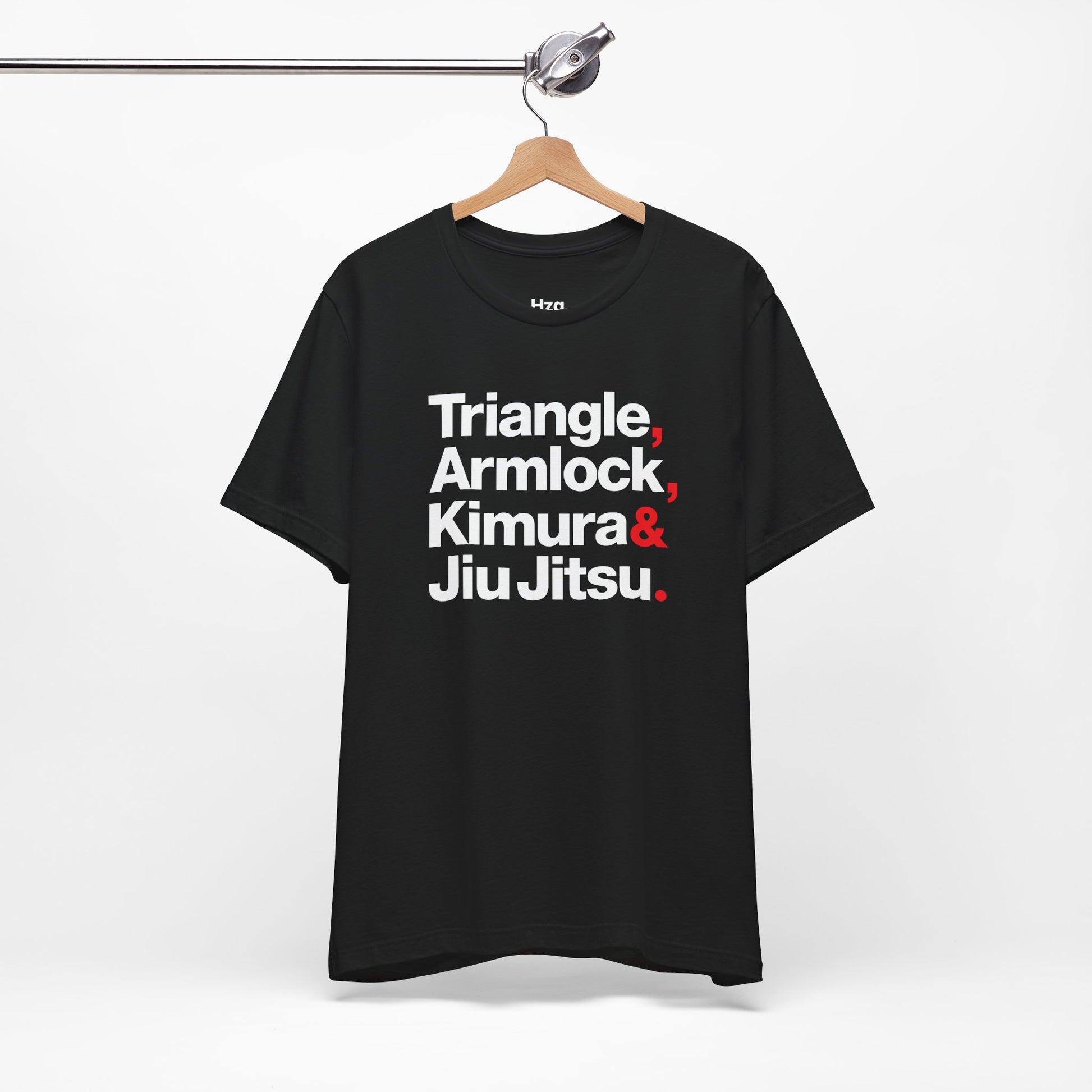 Black t-shirt with white and red text on a hanger against a white background